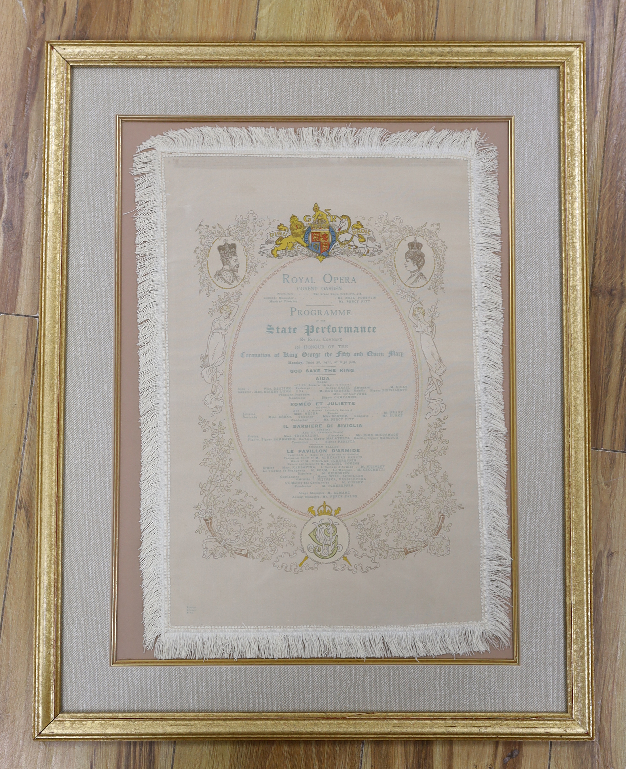A framed early 20th century silk opera programme, Royal Opera House Covent Garden, State Performance 26th June 1911, printed by Finden Brown & Co., 41 x 27cm not including fringe